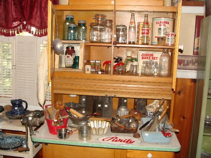 Antique Kitchen Cabinet with roll down top, porcelain table top, drawers and shelves plus look at all the collectibles!
