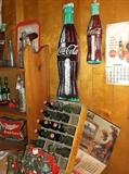 Coca-Cola thermometers, calendar, crate, and bottles