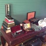 Vintage Dr's Exam Table & Medical Equipment; including Dr. Peck's Microscope, 1920 Violet Ray Gun Quack Medical & Wands, ECG Machine, Odescope and Wheel Chair to name a few!  