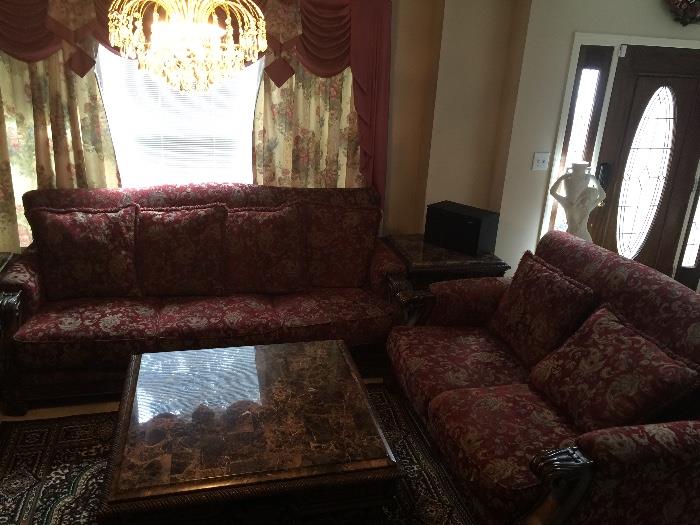 Red jacquard sofa and loveseat, marble tables 