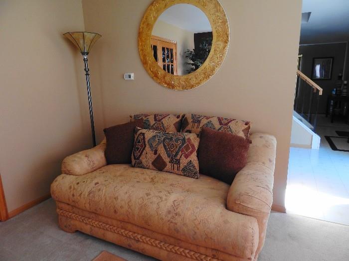 Loveseat, wall mirror,  and lamp