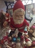Plush Santa sorting his vintage ornaments