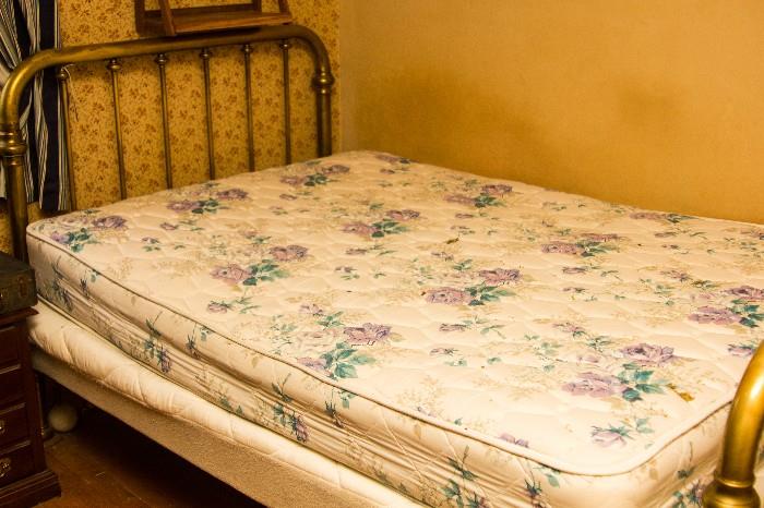 Antique brass bed with new full bed mattresses. 