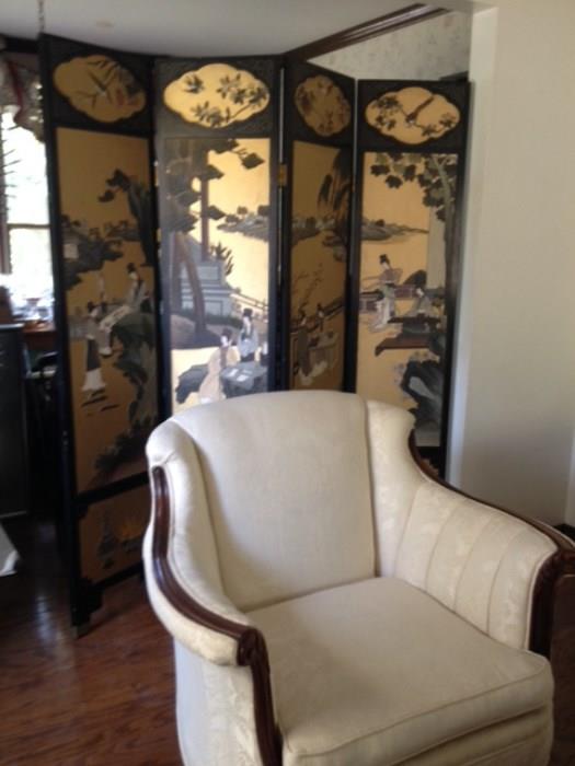 Front of Coromandel Oriental screen.  Victorian chair.