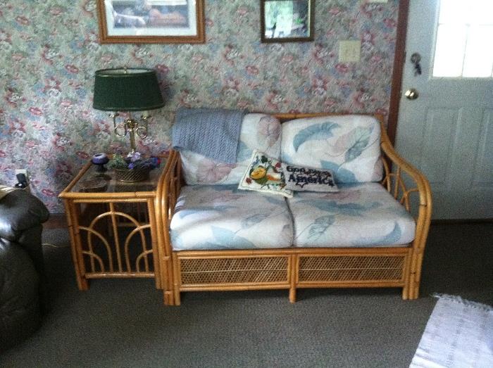 Cane set includes love seat, side table, chair and foot stool