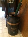 Vintage milk can great for umbrella holder