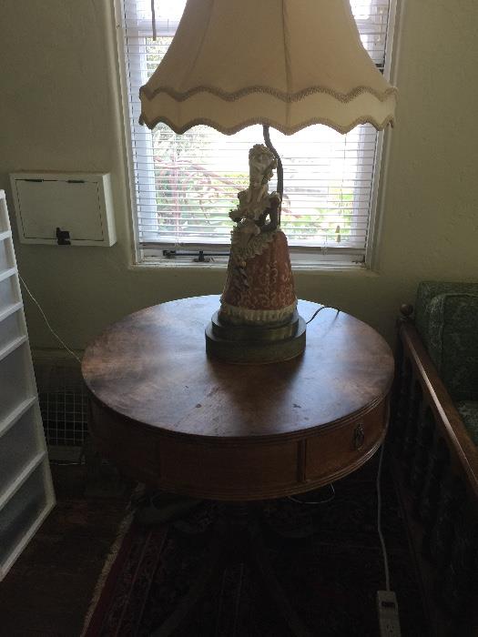Round antique side table and porcelain lamp (lamp part of a pair - large porcelain man and woman)