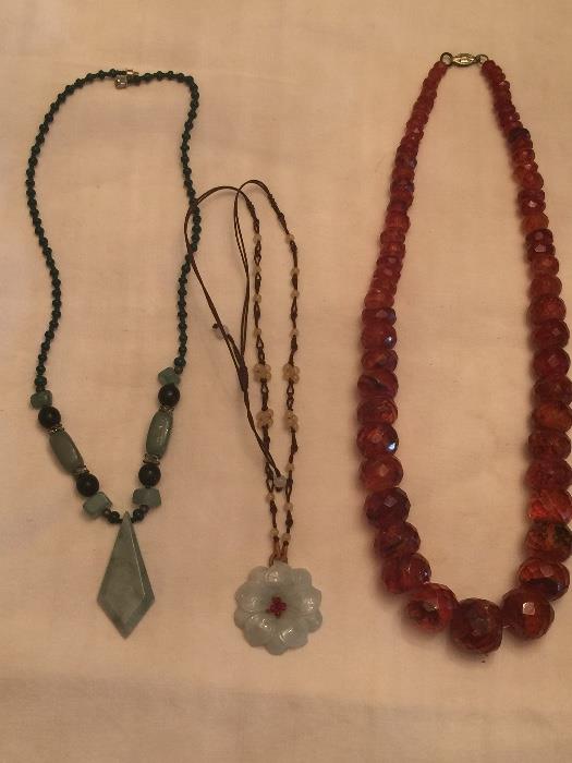 Jade pendants and faceted graduated amber bead necklace