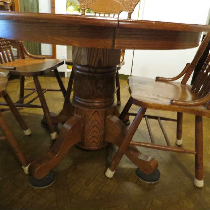 Oak pedestal table with leaf and 4 chairs