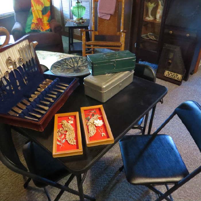 folding table and 4 chairs; Wm Rogers flatware with box; shell pictures; vintage metal boxes