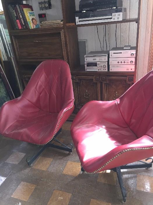 Mid-Century red leather swivel chairs