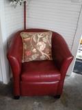 One of 3 red leather chairs - there is also a matching loveseat