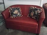 Red leather love seat - has matching leather chairs