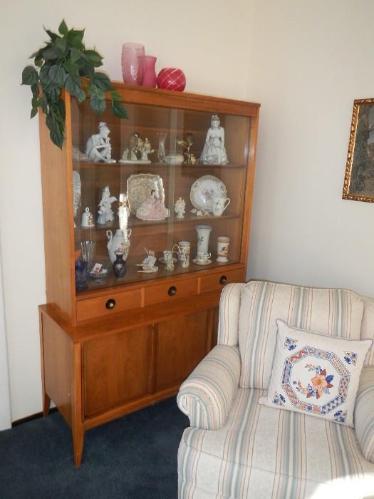 Figurines in china cabinet family kept