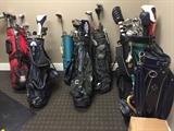 Several sets of golf clubs