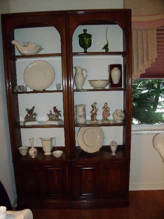 Pair wood curio cabinets.  Lighted with glass shelves.  Shelves have grooves for plates.  