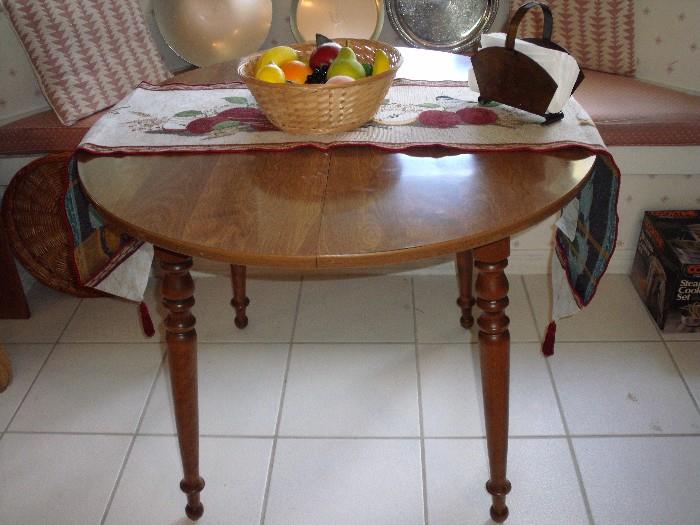 Kitchen table shown without the leaf.  No chairs