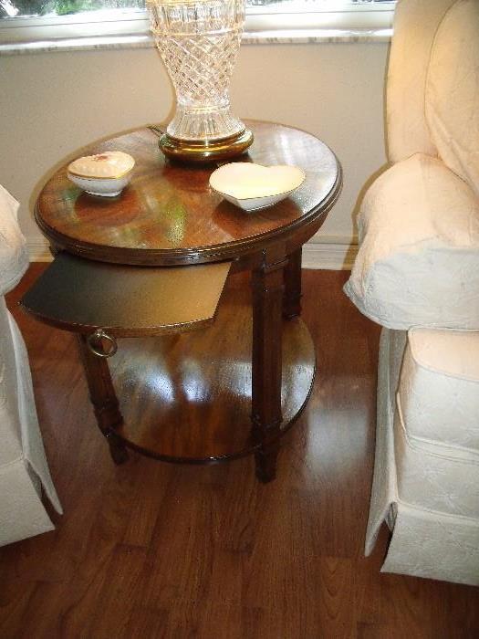 Oval wood tea table.  Tray slides back into the table when not in use