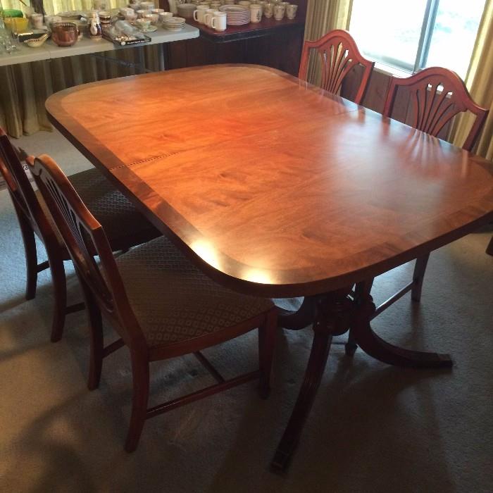 Morganton Dining Table w/6 chairs & 3 leaves.  2 captain chairs & 4 armless.  45" wide x 64.5" long w/o leaves.  Each leaf is 12" wide