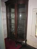 Beautiful Curio with curved glass.  The picture does not do it justice.   Very good condition.
