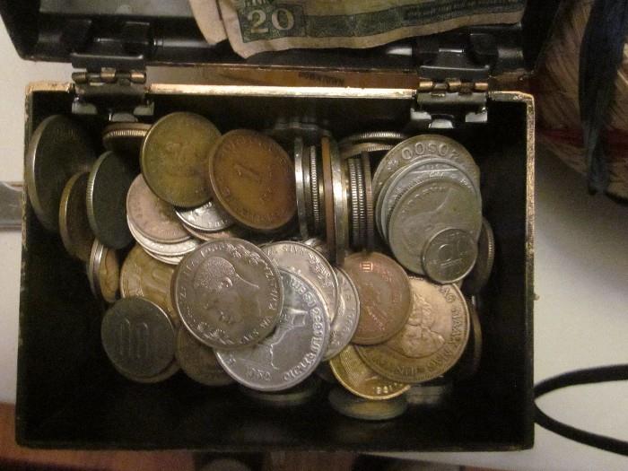 Collection of foreign coins.  Includes a  few 1966 Rands, several large English pennies, a couple other silver coins. 