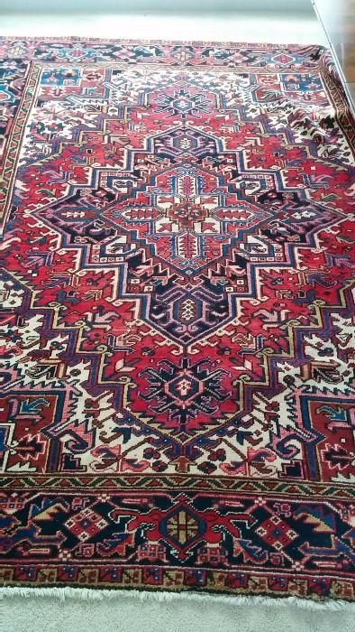 A lovely hand woven, 100% wool Persian Heriz, hiding under the invisible dining room table perched atop the rug; measures 7'5" x 9'6"