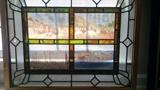 Wonderful antique stained glass panel, one of a pair, featuring European cities and 3-D colored glass "diamonds" 