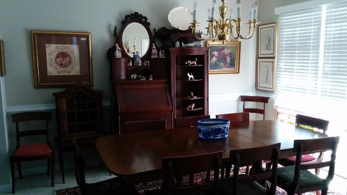 Here's a better pic of the mahogany table. It has three leaves and 12 chairs. There's also the Victorian desk/chest/display cabinet thing. It's quite nice, once I put my magic spit on it.