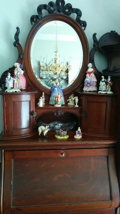 Roayl Doulton figurines: "June", "Veronica" and "A Victorian Lady". Also, a collection of "Sebastian Miniatures", designed by Prescott W. Bastom, of Marblehead, MA. Perhaps he should have his head examined...