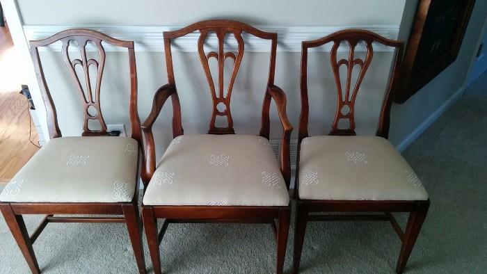 Rogue mahogany dining chairs, from a broken home. This poor Mother chair is trying to raise two children, while working three jobs.                                                     She can barely afford acrylic nails and hair extensions. Please help, if you can find it in your heart to do so.