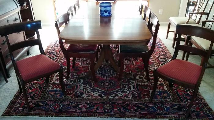 Nice shot of the mahogany dining table, Persian Heriz rug and two of the side chairs.