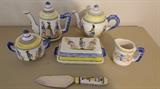 Quimper Collection tea pot, coffee pot, sugar, creamer, butter dish, and serving knife