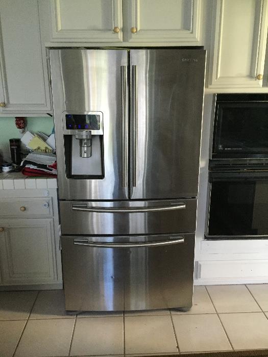 Samsung Stainless Steel Refridgerator!  French doors, middle draw and bottom freezer- all with a ton of room!  Would not sell if it fit in our new home!!