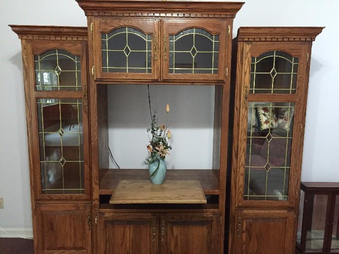 Entertainment Unit with beautiful glass doors and inside lighting. Three separate pieces for easy moving.