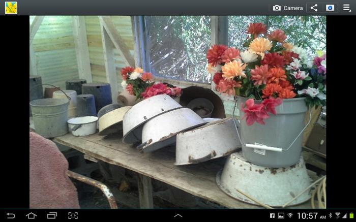 Tubs, wash pans, planters, lots of artificial flowers.