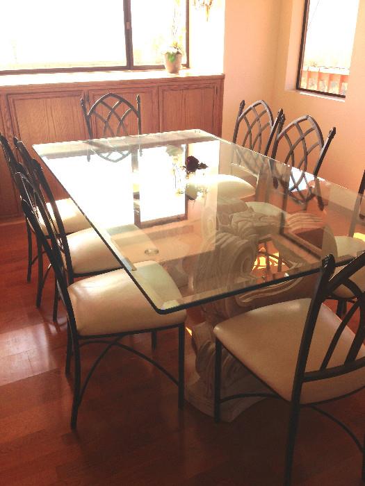 Contemporary glass dining table with eight chairs
