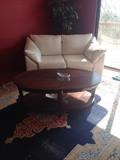 Leather loveseat and wood coffee table