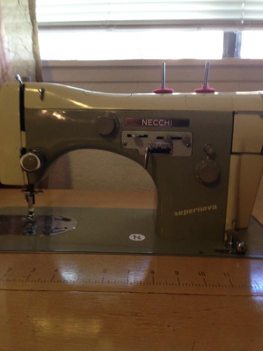Necchi 1950s Supernova sewing machine, with table and original parts kit