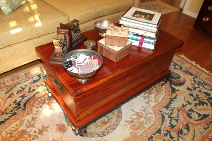 Trunk coffee table, books, and misc. decor
