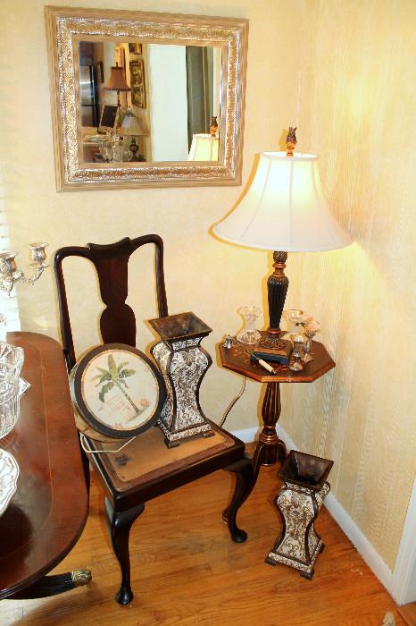 Small table, lamp, mirror, and decor