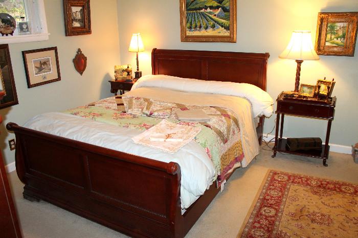 Queen sleigh bed, nightstands, lamps, and original paintings