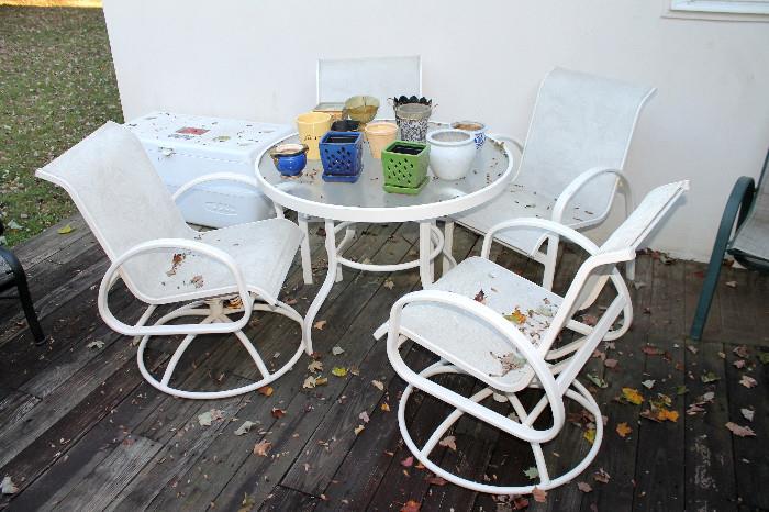 Outdoor glass-top table and 4 chairs
