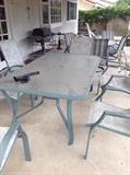 Patio set with 6 chairs. Also another round with 4 chair set. Two lounge chairs same style 