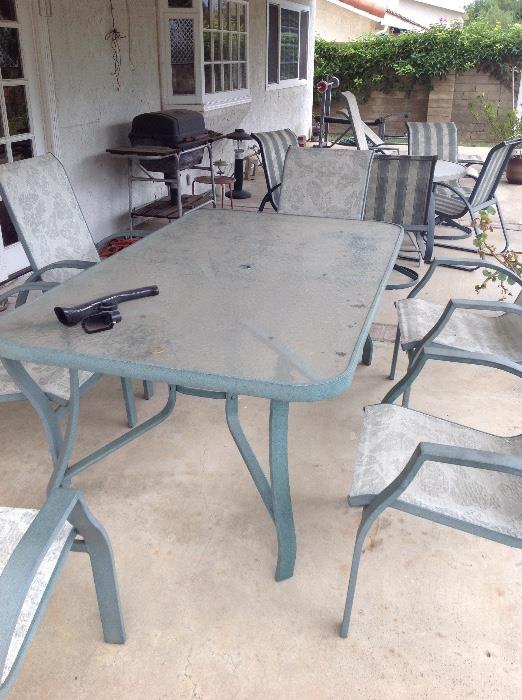 Patio set with 6 chairs. Also another round with 4 chair set. Two lounge chairs same style 