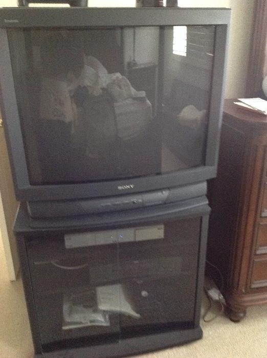 Sony Triniton 32" TV. RCA VHS player. Media cabinet