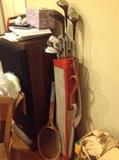 Golf clubs, bow and arrows, tennis racket, bike helmet 
