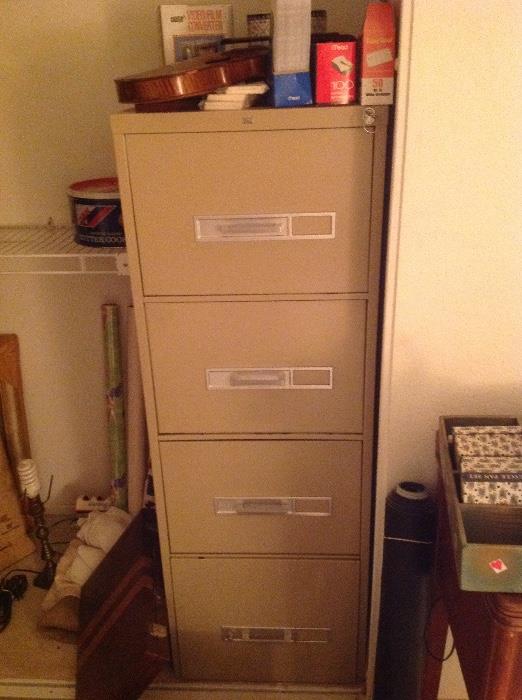 Two four drawer locking file cabinets - one pictured here 