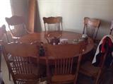 Antique 1930s oak round dining set with 3 leaves and 8 chairs.