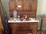 Hoosier oak with flour bin. Vintage cooking items. Oak antique Bench bath in front. 