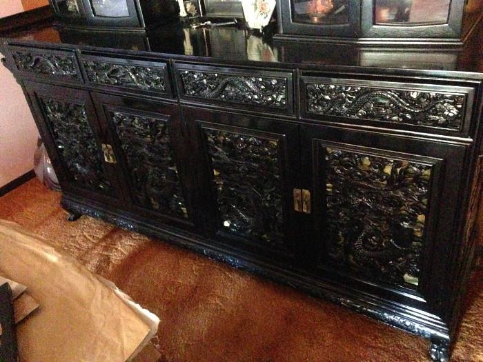 Stunning one of a kind hand carved teak, rubbed lacquer Chinese buffet depicting Kyan Kung